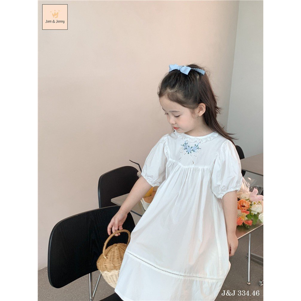 Váy trắng thô cotton J J thêu hoa ngực
