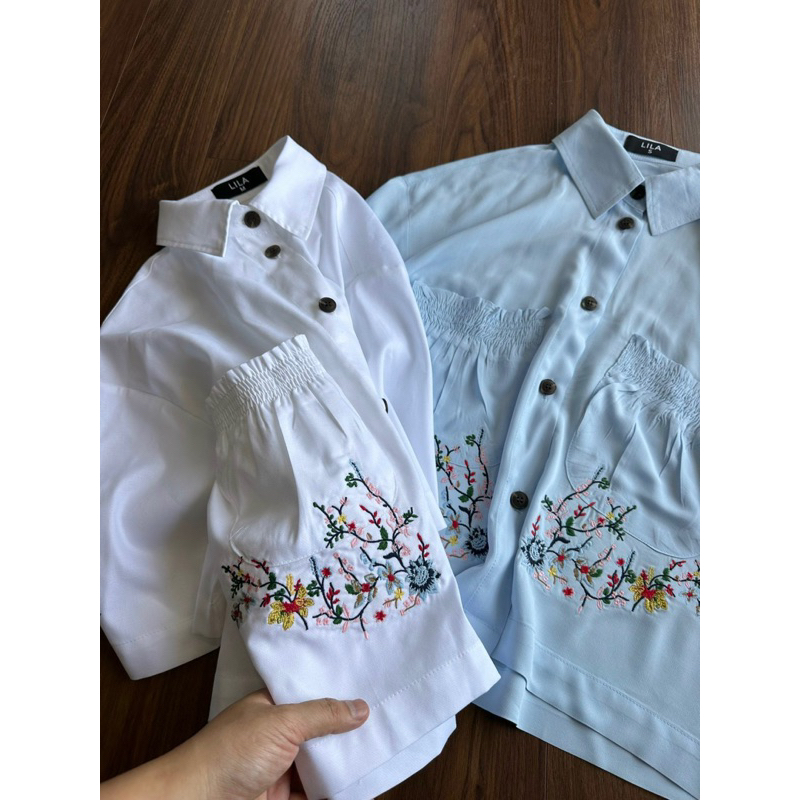 Áo sơmi nữ kiểu vạt ngang cách điệu