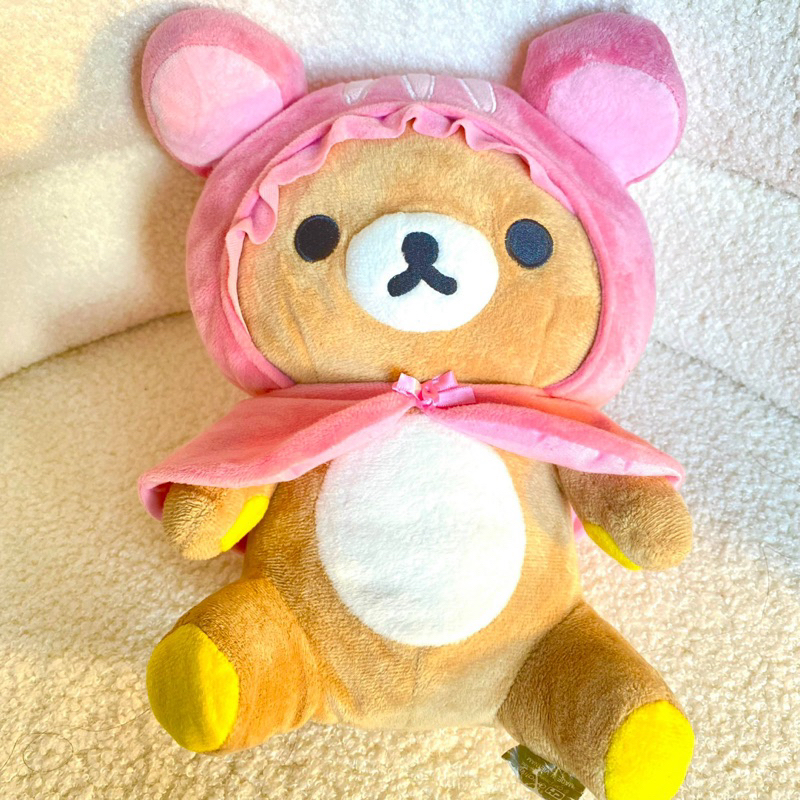 Gấu bông Rila- Rilakkuma Nhật đội mũ và áo choàng hồng