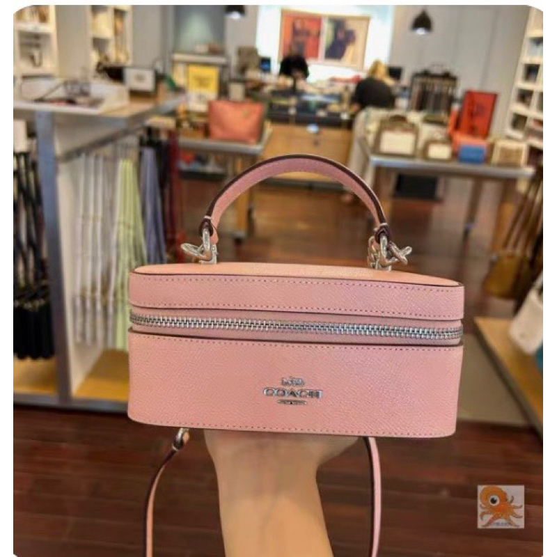 Túi Coach train case màu hồng