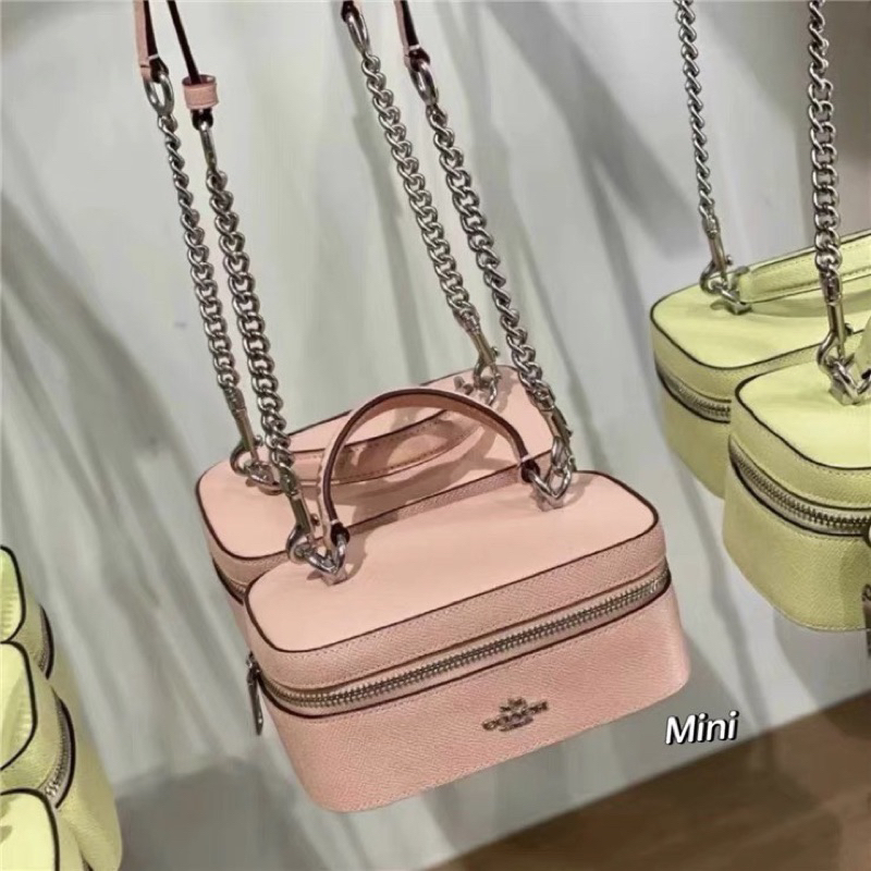 Túi Coach train case màu hồng