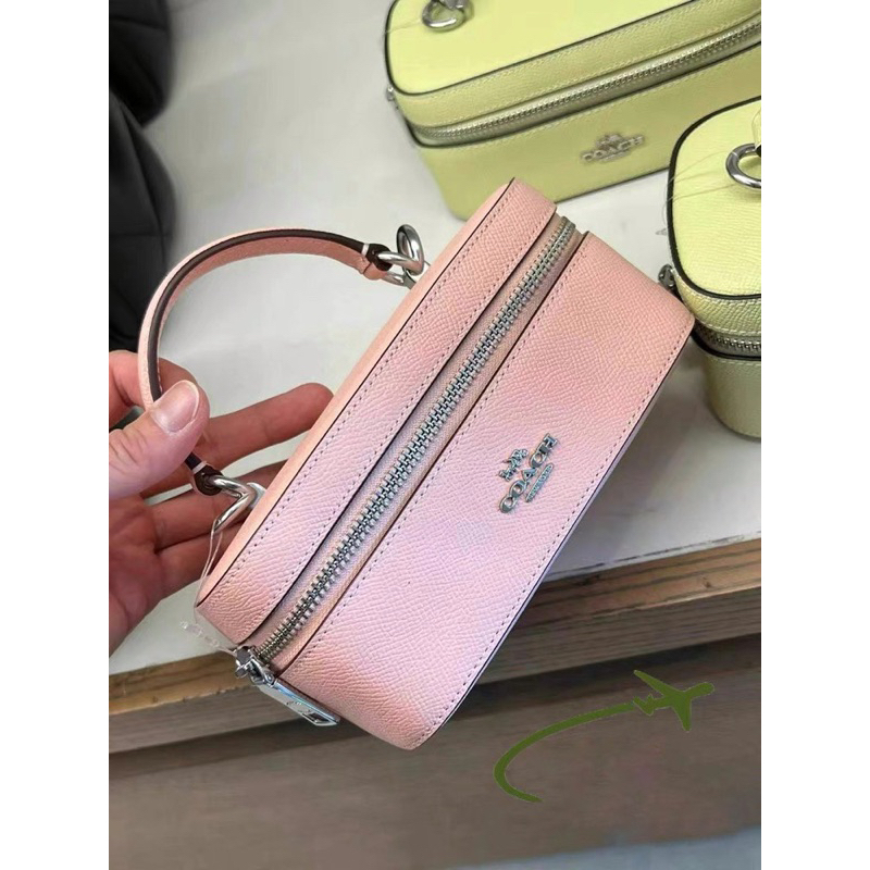 Túi Coach train case màu hồng