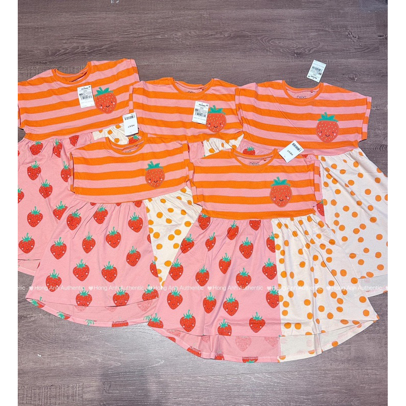 Đầm cam hoạ tiết dâu siu xinh cho bé iuu