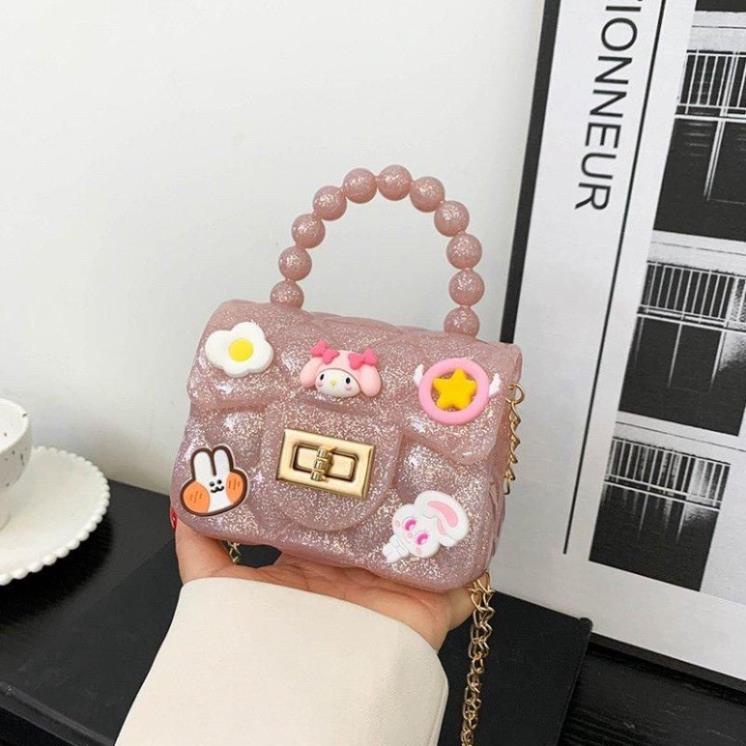 Túi Nhựa Mini Quai Ngọc Đeo Chéo Có Dán Sticker Hoạt Hình Ngộ Nghĩnh Cho BéTúi Quai Ngọc Trai Nhân Tạo
