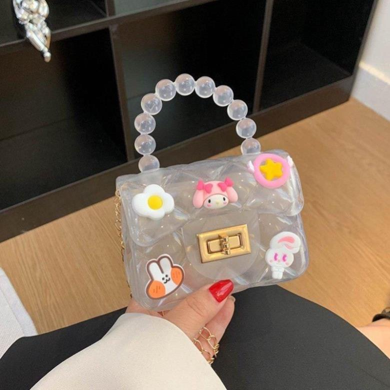 Túi Nhựa Mini Quai Ngọc Đeo Chéo Có Dán Sticker Hoạt Hình Ngộ Nghĩnh Cho BéTúi Quai Ngọc Trai Nhân Tạo