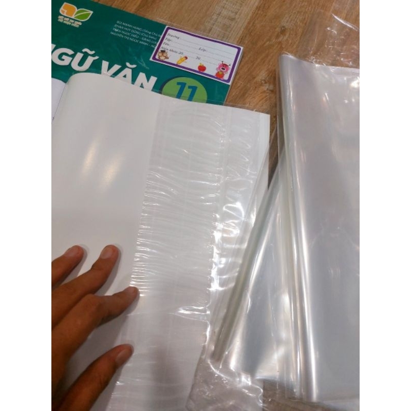 1 TỜ GIẤY BAO SÁCH CẢI CÁCH NILON DÀY BÌNH TÂN - GIẤY BAO KIẾNG 26.7CM BAO SÁCH CẢI CÁCH SẴN KEO KHÔNG HÌNH NAI