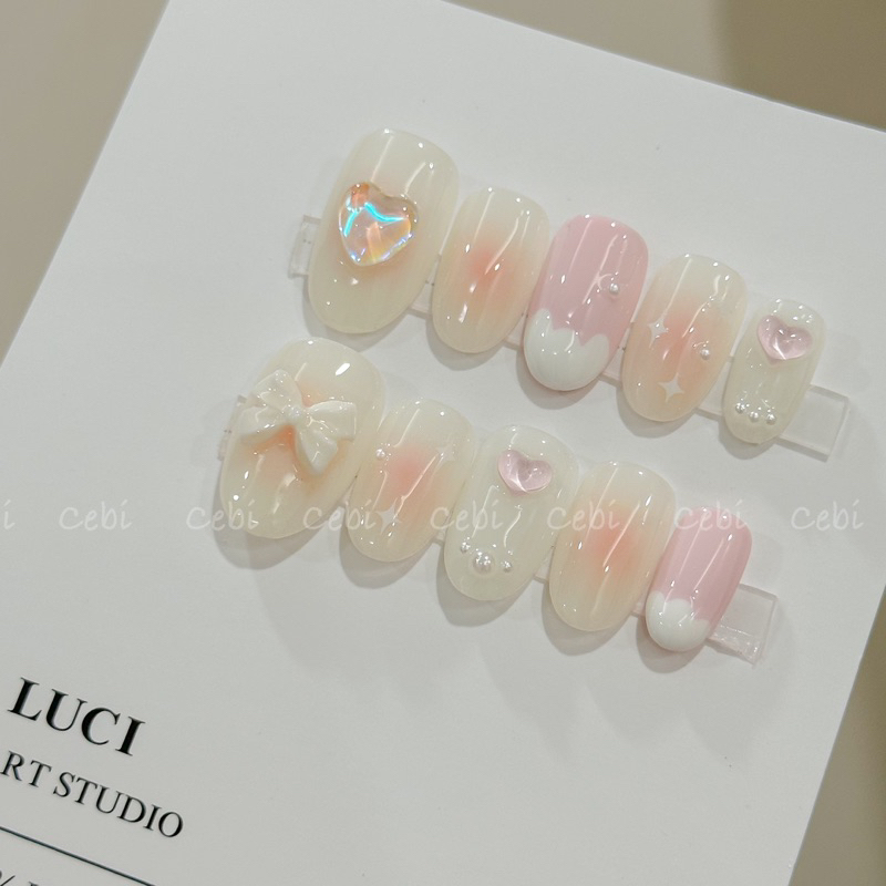 Móng úp thiết kế L006 hồng ombre đính charm nơ trái tim kem chảy luci.nailbox
