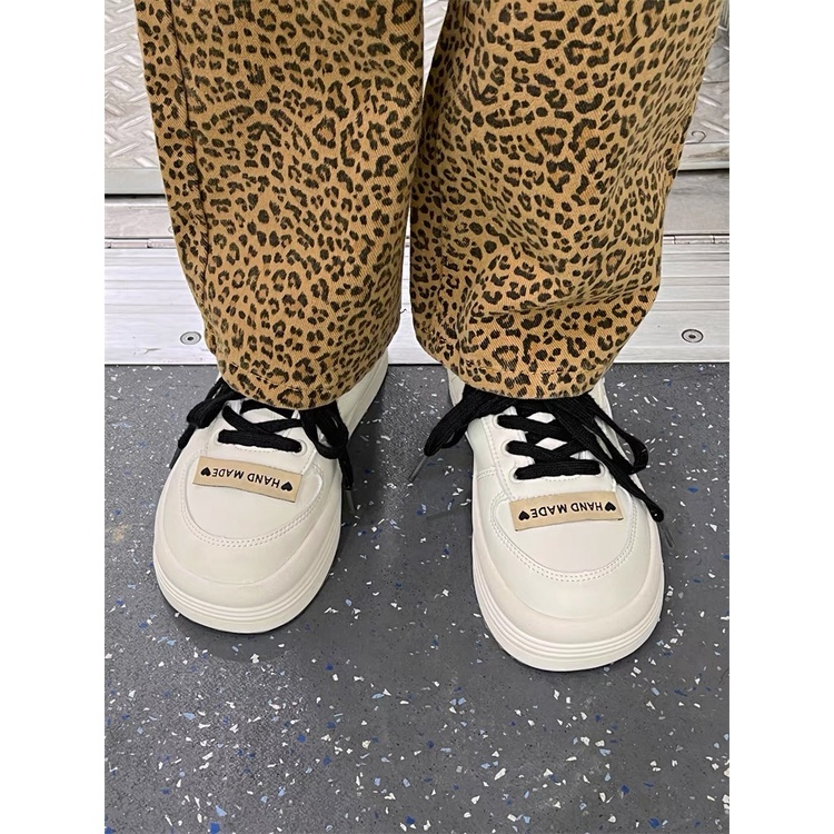 Giày thể thao nữ đế bằng dây đen