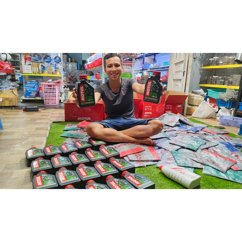 Nhớt motul 3100 GOLD kèm áo mưa