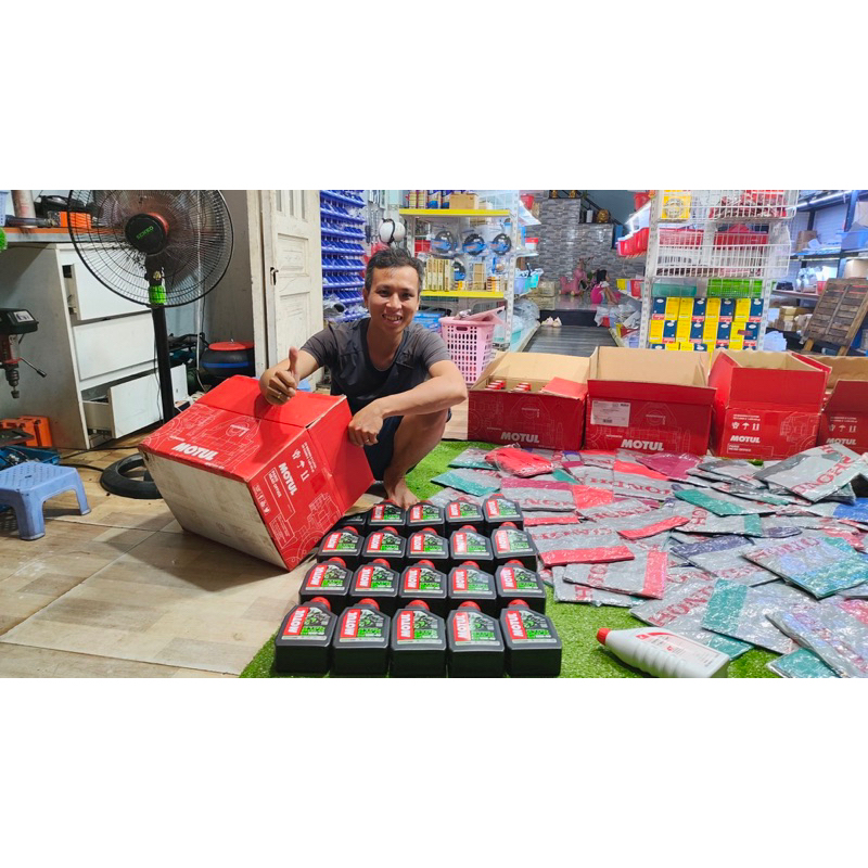 Nhớt motul 3100 GOLD kèm áo mưa