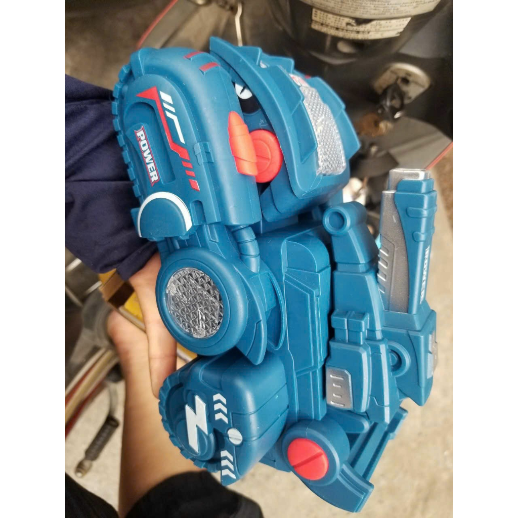 Xe khủng long biến hình  có đèn và phát nhạc