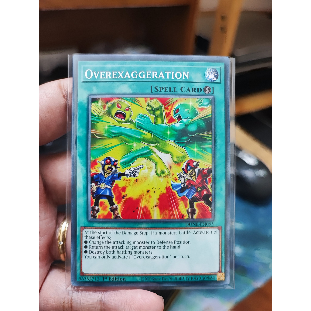 1 lá thẻ bài Overexaggeration - DUNE-EN065 - Common 1st Edition