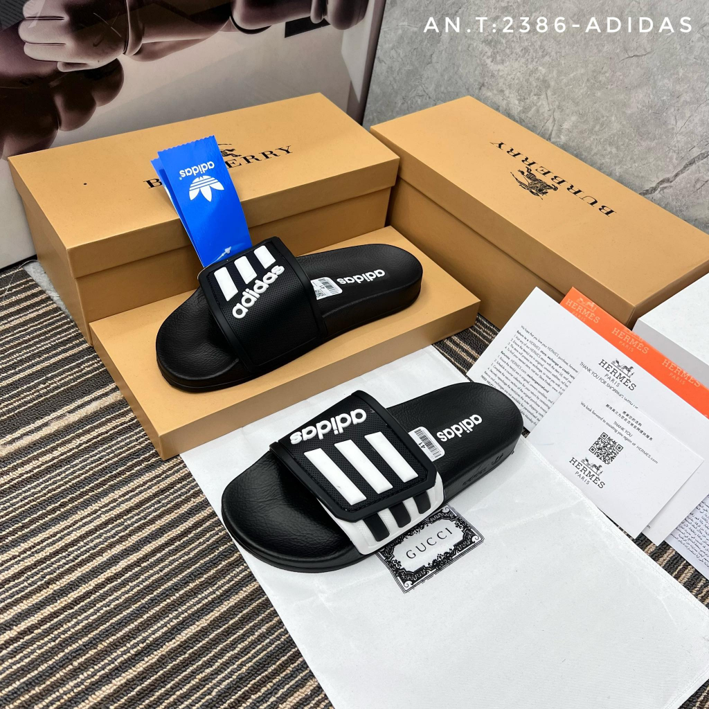 Dép adidas quai khâu mẫu mới 3 sọc 2 màu đen vàng - new 2023