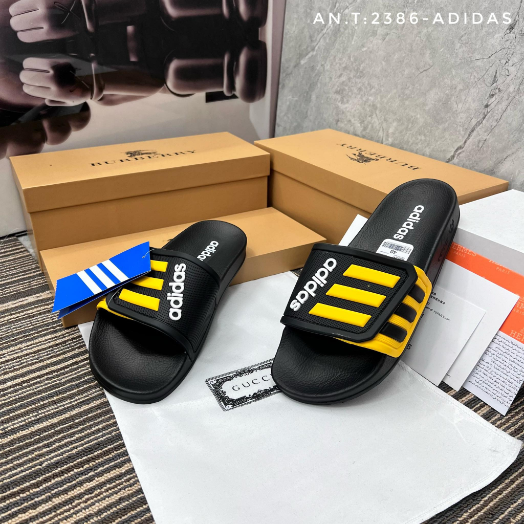 Dép adidas quai khâu mẫu mới 3 sọc 2 màu đen vàng - new 2023