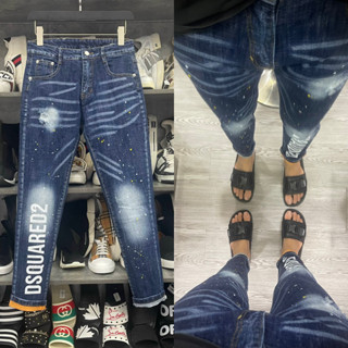 Quần jean bò nam Dsq2 slimfit xanh bạc rách xước vảy sơn dập chữ Dsquared2 dọc ống xắn cam QJ284P