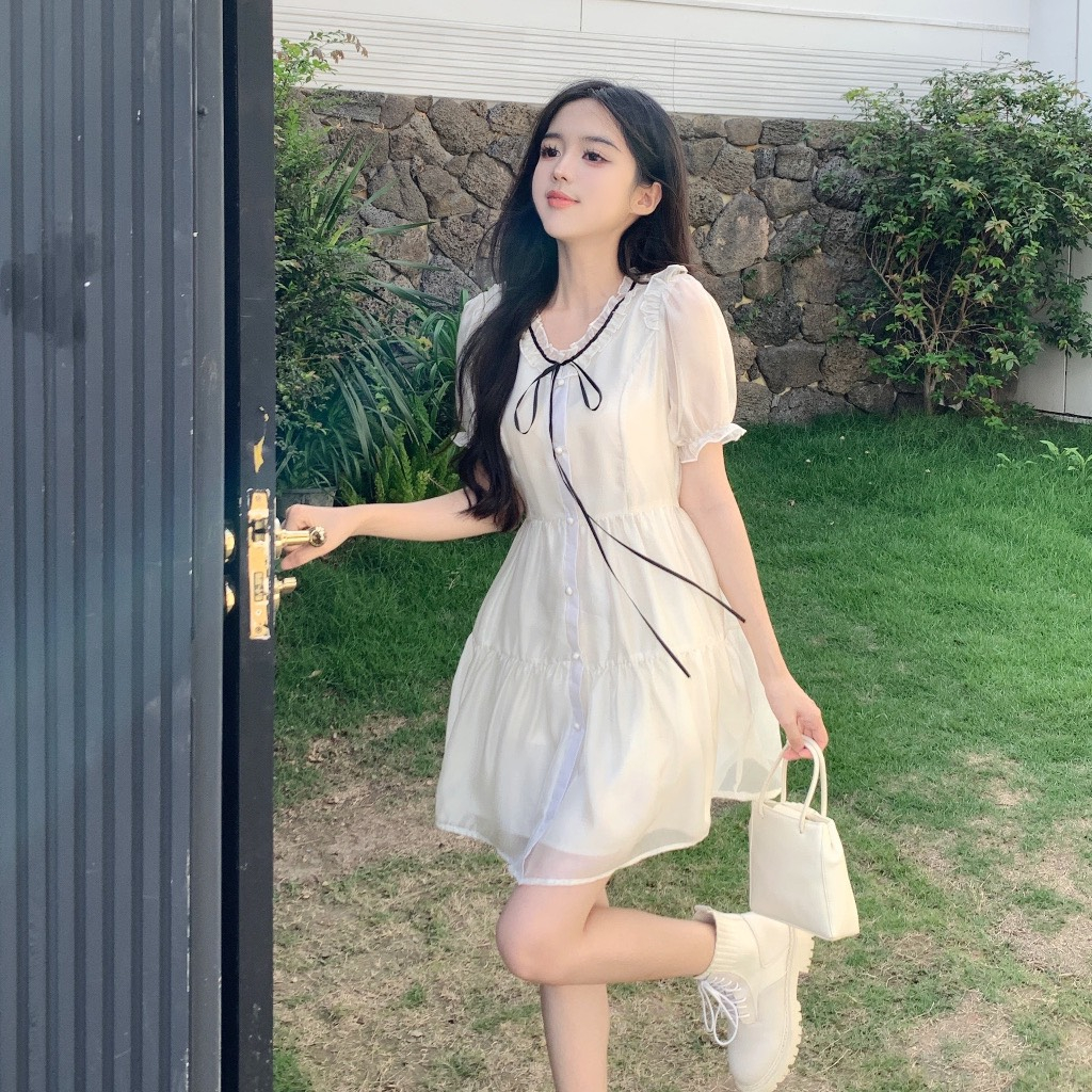 Váy Voan Cổ Bèo Cúc Ngọc Thắt Dây Nơ Dáng Xoè Màu Kem Mặc Đi Chơi