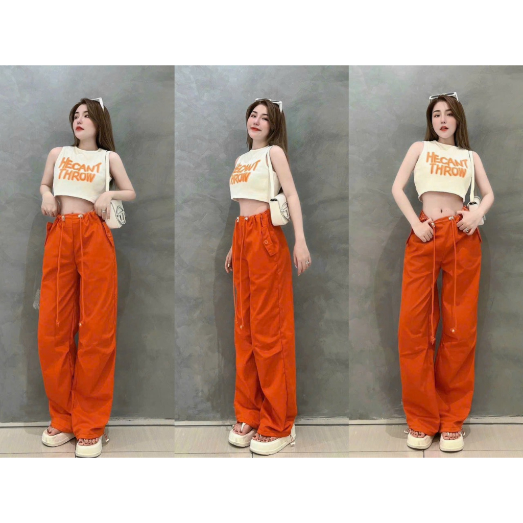 Set bộ đô nữ áo trắng croptop ba lỗ họa tiết in chữ phối quần màu cam ống rộng dây rút eo cá tính trẻ trung