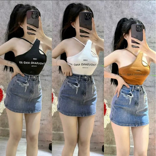 Set áo croptop dây chéo in chữ và chân váy jean body rách túi kiểu
