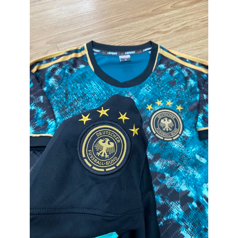 Quần áo bóng đá vải thun lạnh tuyển Đức màu xanh rêu in tên số theo yêu cầu