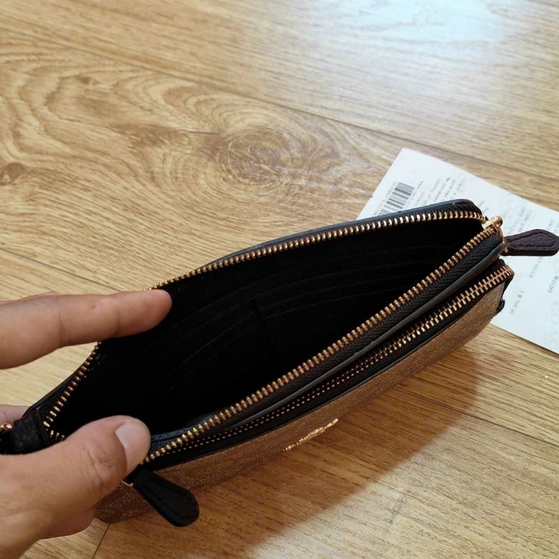 Ví C0ach cầm tay siêu sang