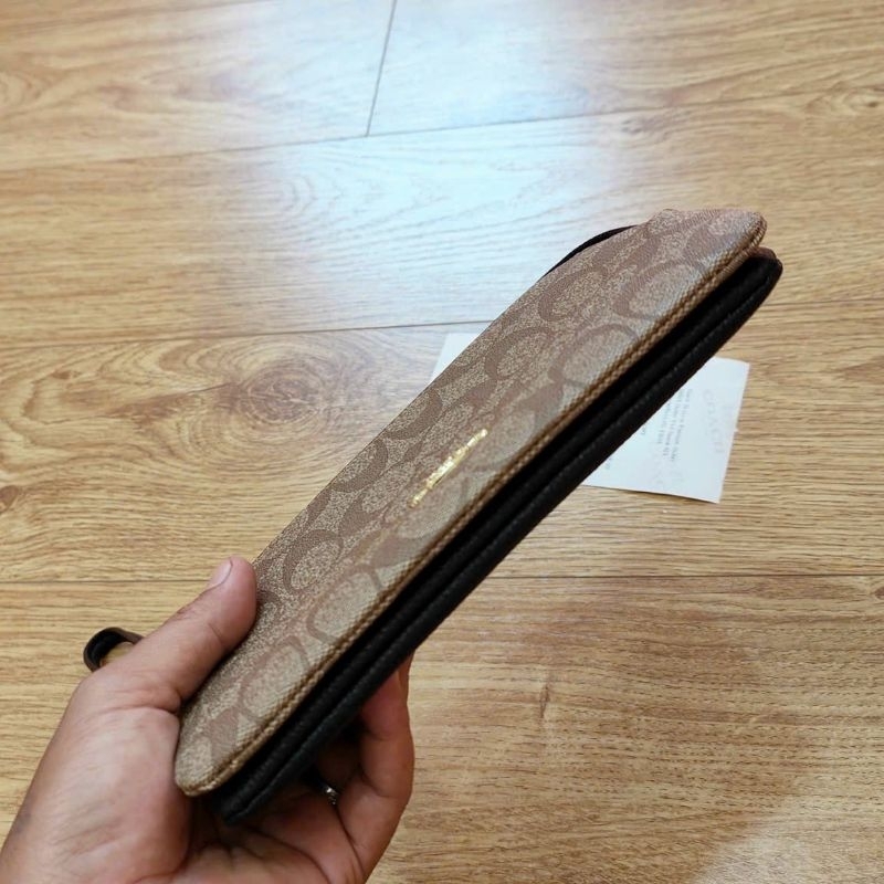 Ví C0ach cầm tay siêu sang