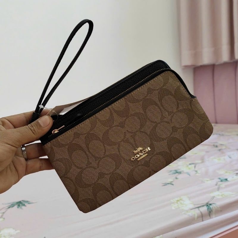 Ví C0ach cầm tay siêu sang