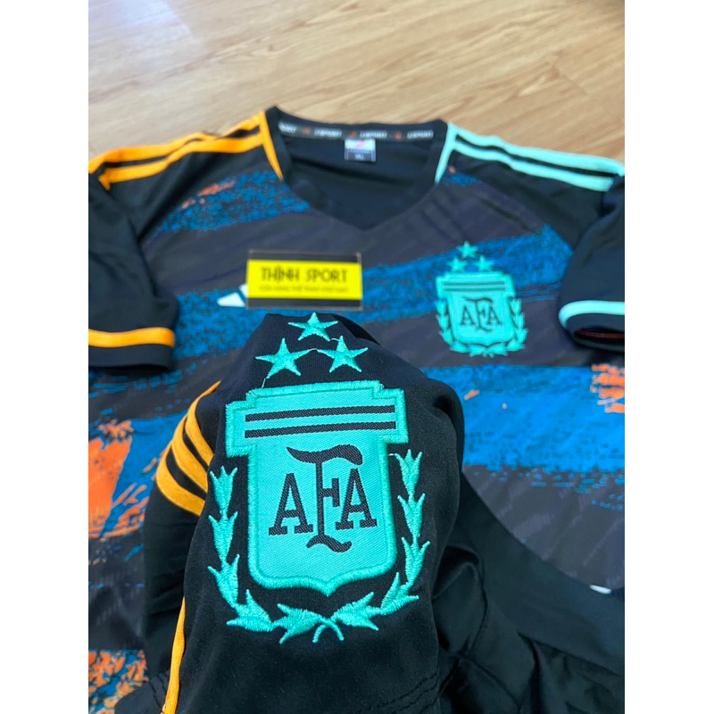 Quần áo bóng đá vải thun lạnh tuyển A gen ti na xanh đen phối cam in tên số theo yêu cầu