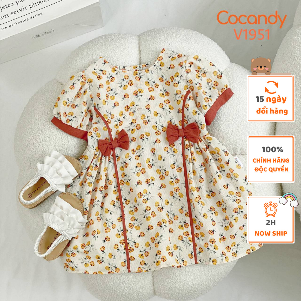 Váy cho bé -Váy cộc hoa VÀNG phối 2 nơ HỒNG cho bé của COCANDY mã V1951