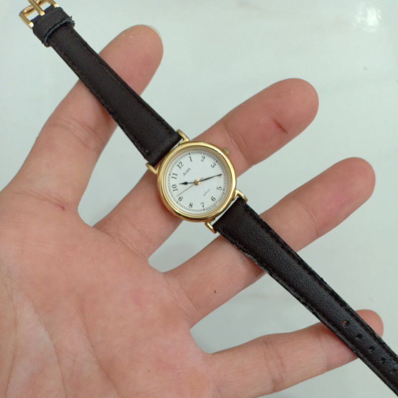 Đồng hồ si nhật nữ dây da hiệu ALBA mạ vàng