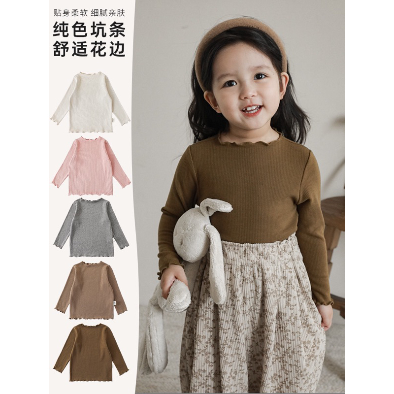 Áo dài tay thun gân màu trơn cổ viền bèo cho bé gái