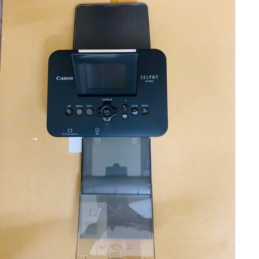 Máy in ảnh Canon Selphy CP1000 - in ảnh thẻ, ảnh gia đình,mã QR độ bền 100 năm