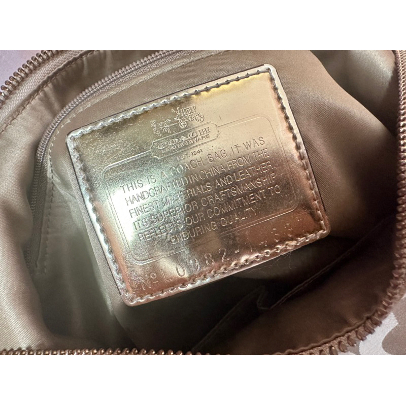 Túi đeo chéo Coach