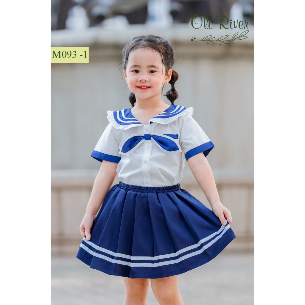 Set bé gái Oli River thiết kế áo thủy thủ phối nơ mix chân váy tennis cho Bé diện đi học chất liệu thô cho bé từ 1-10 tu