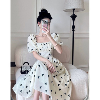 Đầm hở lưng nơ đen váy trắng tim