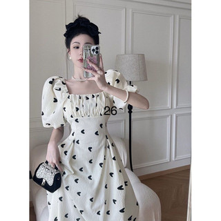 Đầm hở lưng nơ đen váy trắng tim