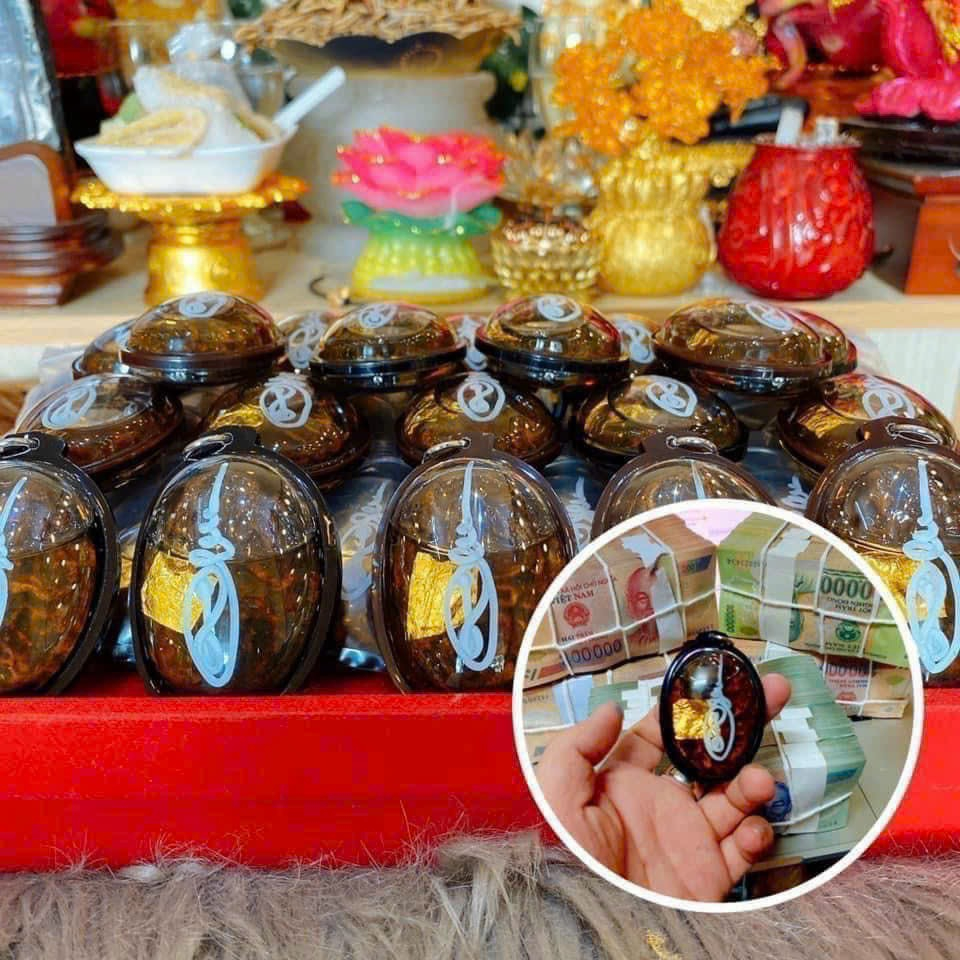 Móc khoá mèo dầu có chú của thái lan