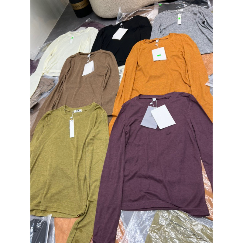 Áo thun giấy xỏ tay hàng QC