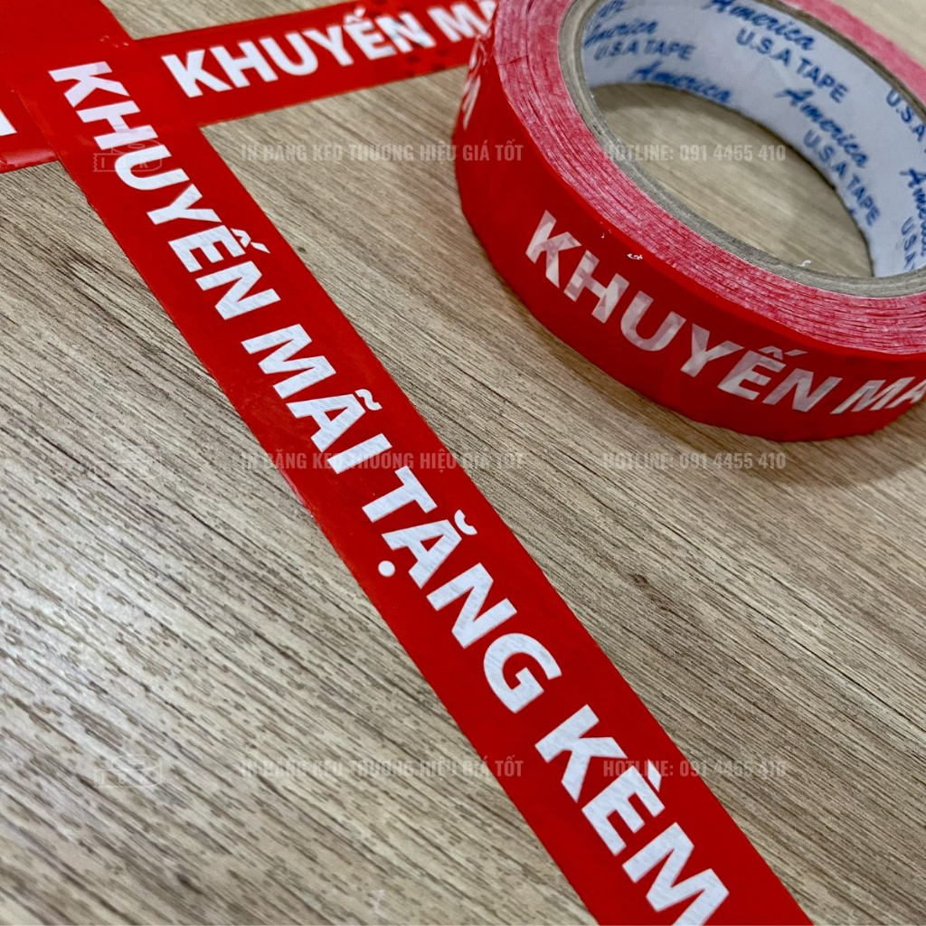 Băng Keo Khuyến Mãi Tặng Kèm màu đỏ chữ trắng dài 72met