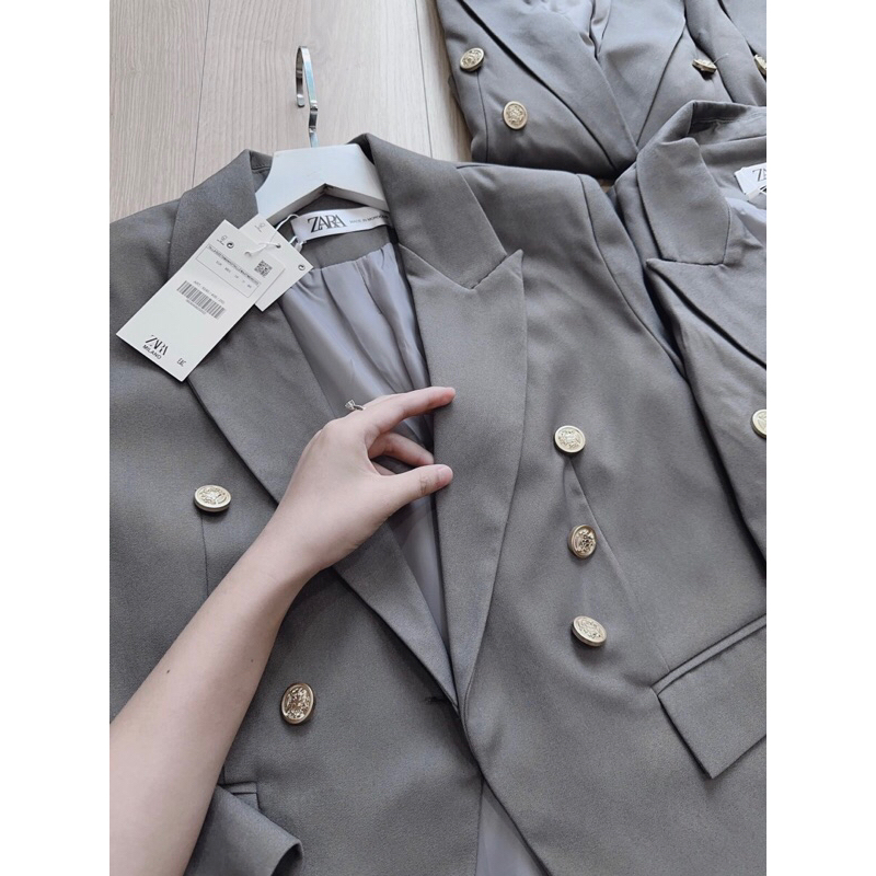 ÁO VEST GHI KHUY ĐỒNG