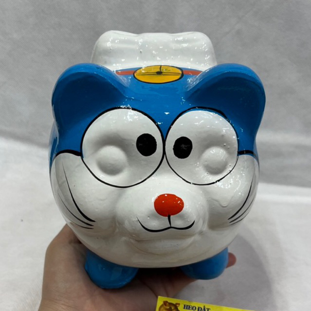 Heo Đất Tiết Kiệm Sơn Phủ Bóng Doraemon Màu Xanh Size Nhỏ 16cm * 15cm (hàng bóng đẹp)