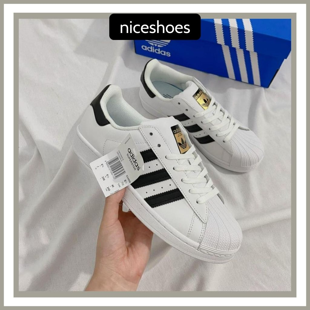 Giày_Adidas Superstar Màu Trắng 3 Sọc Đen Tem Vàng, Giày Thể Thao Nam Nữ Adidas Mũi Sò Trắng Sọc Đen - NICESHOES
