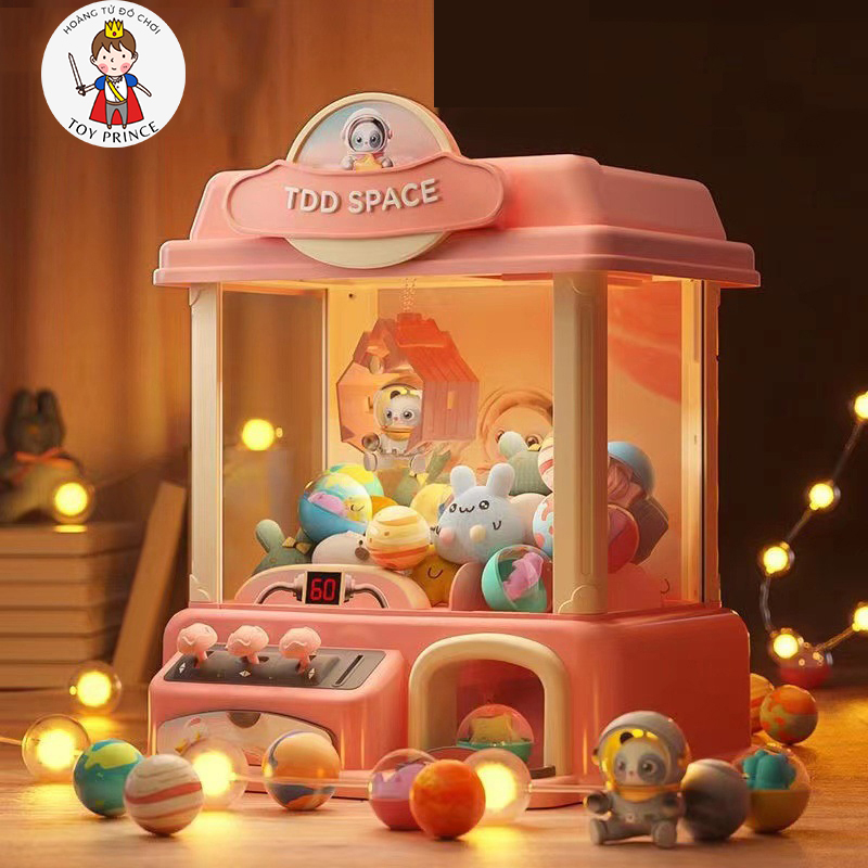 MÁY GẮP THÚ BÔNG MINI PHI HÀNH GIA VŨ TRỤ/ NGÔI NHÀ CỐI XOAY GIÓ PHÁT NHẠC VÀ ĐÈN KÈM NHIỀU THÚ BÔNG PIN VÀ DÂY SẠC