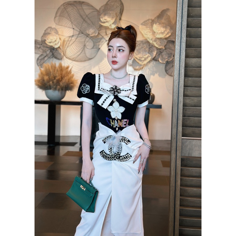 Váy phối viền nơ xẻ vạt lệch Chà neo