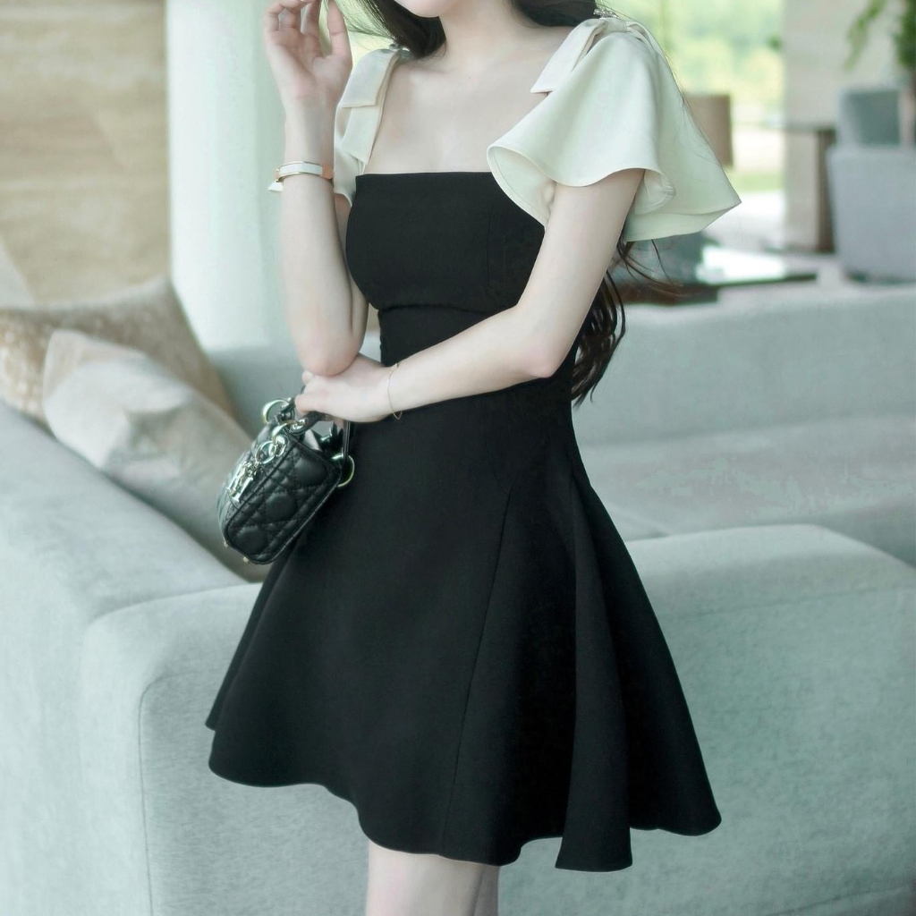 Váy đen xòe tay nơ phối kem xinh trẻ trung Váy Thiết kế đen xòe