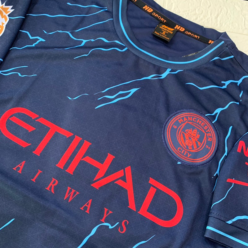 Quần áo bóng đá MANCHESTER CITY bản sân khách màu xanh đen phối hoạ tiết xanh dương vải mè cao cấp mùa giải 2023-2024