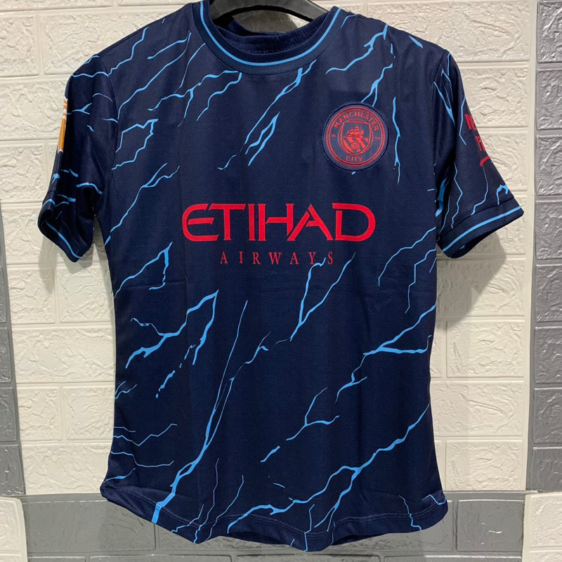 Quần áo bóng đá MANCHESTER CITY bản sân khách màu xanh đen phối hoạ tiết xanh dương vải mè cao cấp mùa giải 2023-2024