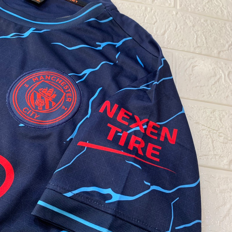 Quần áo bóng đá MANCHESTER CITY bản sân khách màu xanh đen phối hoạ tiết xanh dương vải mè cao cấp mùa giải 2023-2024