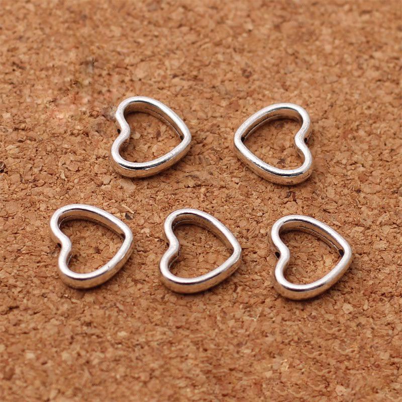 Charm khung đá bọc hạt hình trái tim - KL233