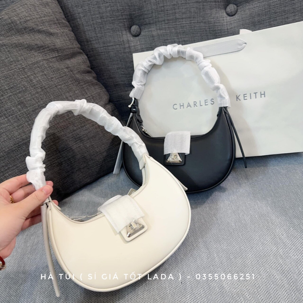 Túi kẹp nách Cê ka trơn dáng bầu cong khóa xoay