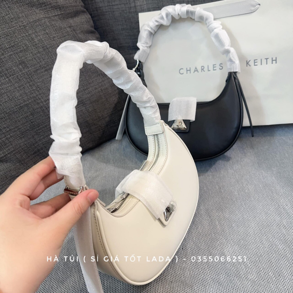 Túi kẹp nách Cê ka trơn dáng bầu cong khóa xoay